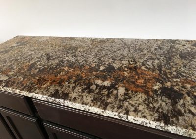 Custom cabinetry with custom natural stone granite countertop by Gordon Creek Granite of Hicksville, Ohio.